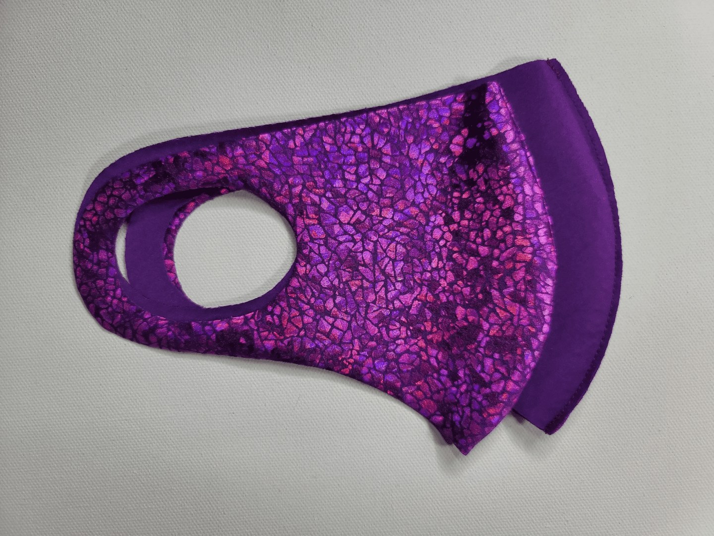 mask with a purple scale pattern