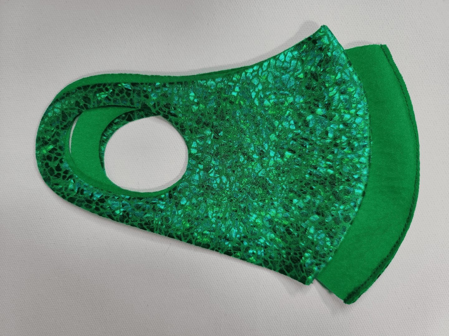 mask with a green scale pattern